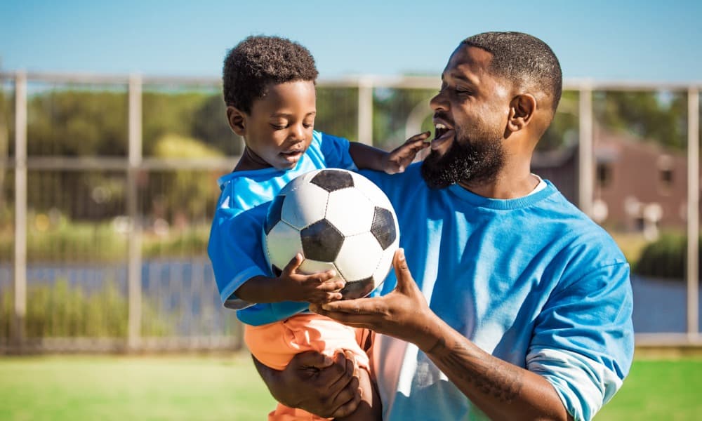 black-father-and-young-son-training-on-the-football-pitch.jpg_s=1024x1024&w=is&k=20&c=BJfevGjtyPsbazDGBULNJ2VAG9_MZ0DjS8aOQ5Y-FWo= (1) Happy friends drinking cocktails at an outdoor bar.