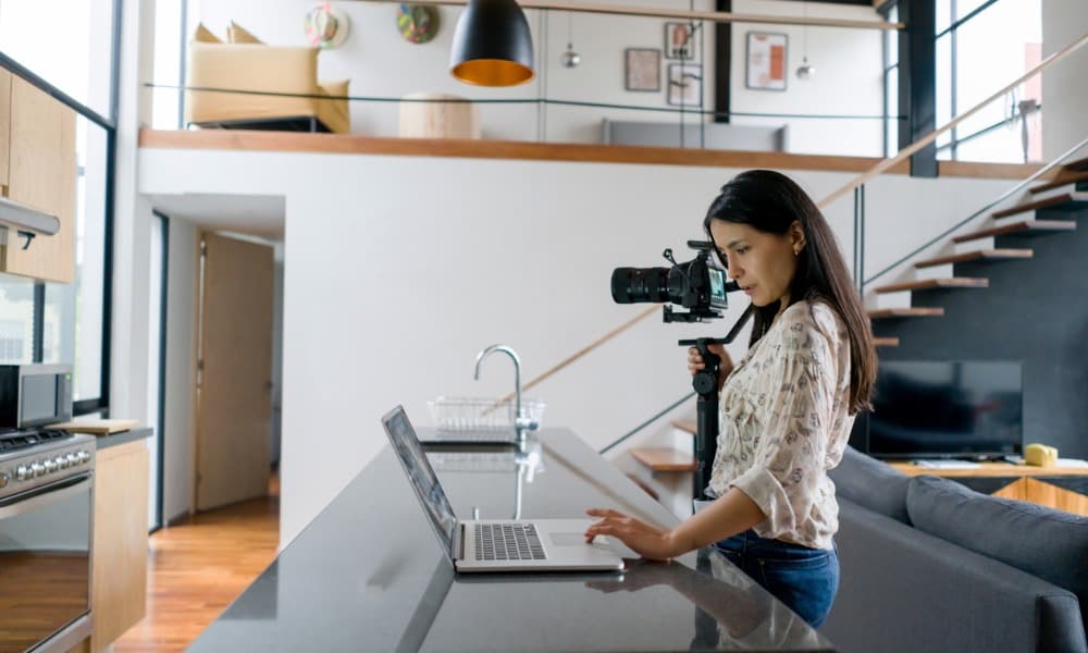 Agent records video inside of a home listing for real estate marketing purposes
