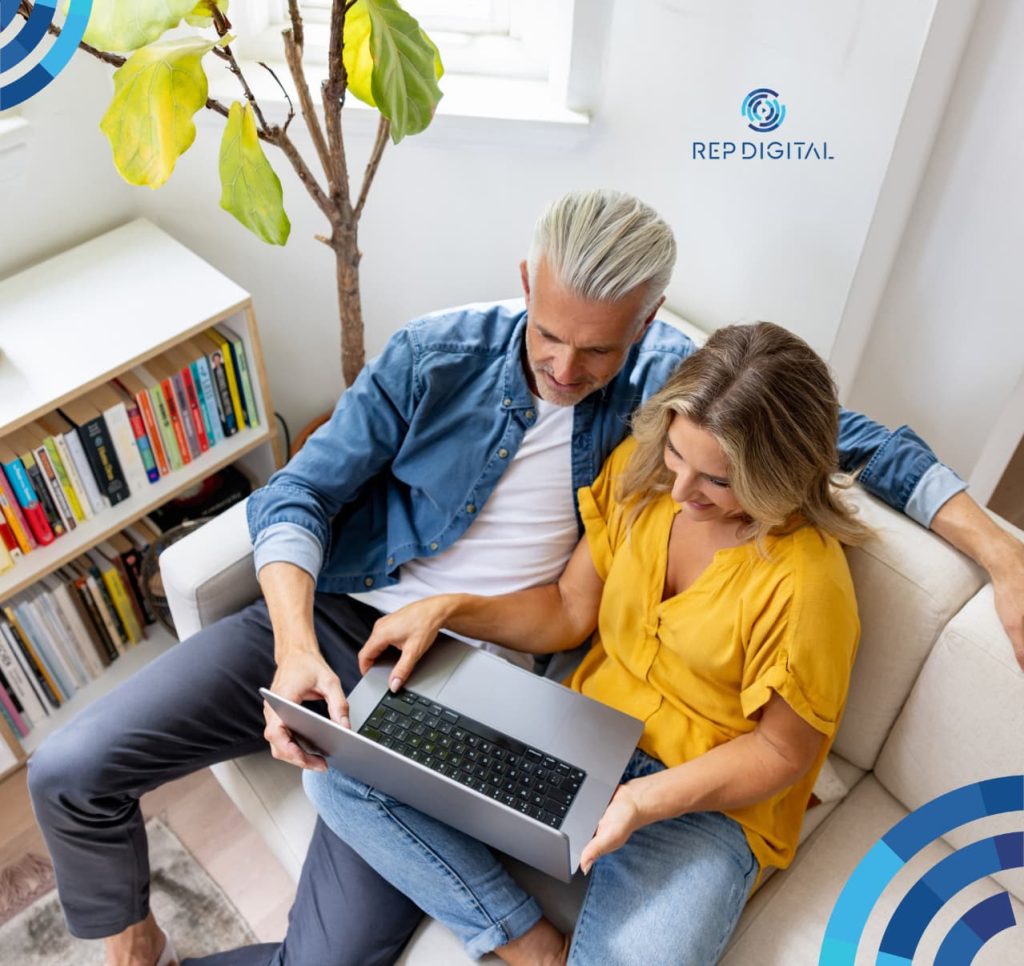 A couple watching a real estate franchise video on their couch